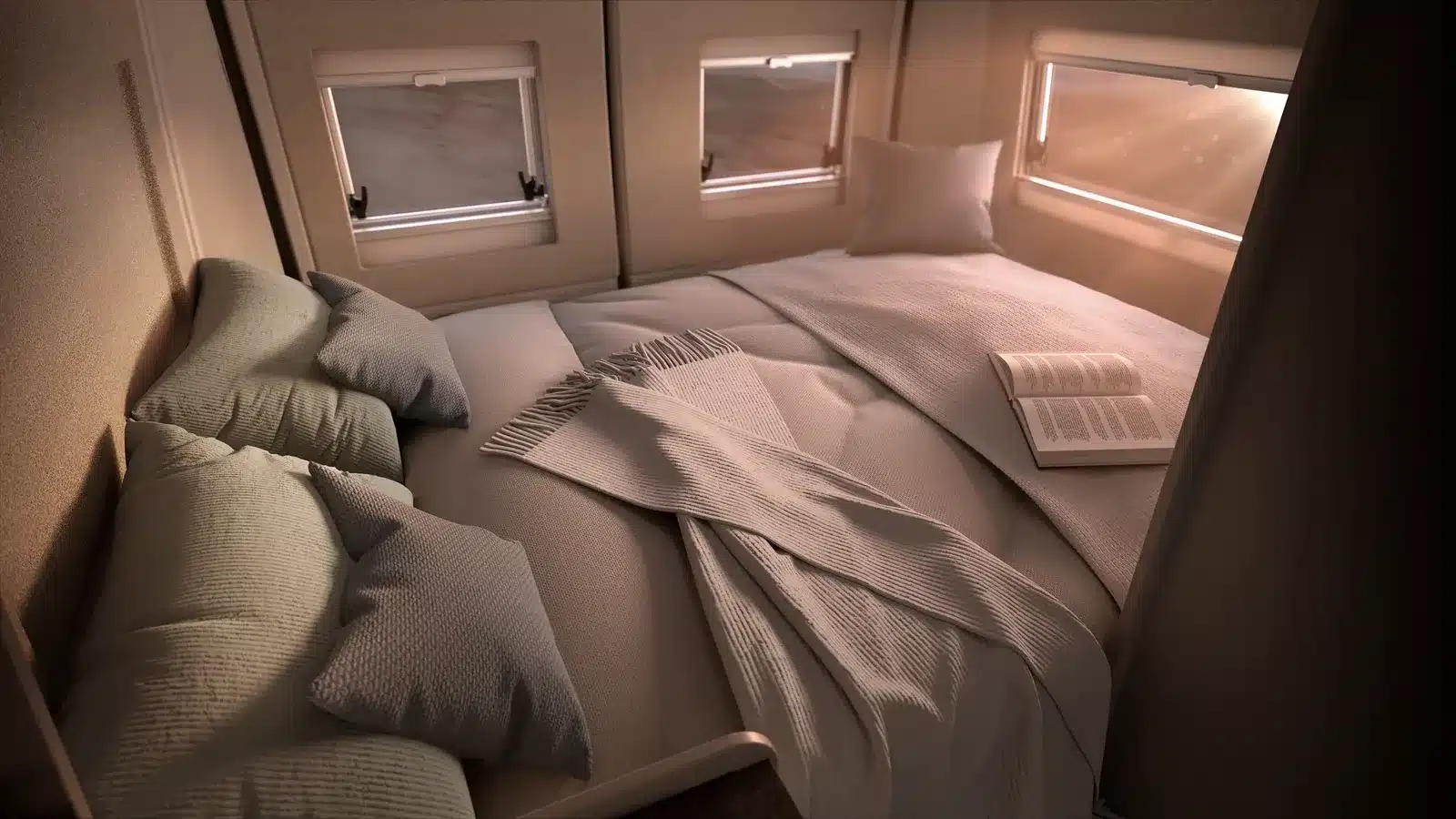Innenansicht des Schlafbereichs im Bürstner Papillon Kastenwagen mit gemachtem Bett, Kissen, Decke und geöffnetem Buch bei Tageslicht