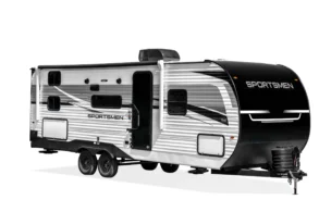 Seitenansicht des KZ Sportsmen SE Travel Trailers mit markanter Grafik und Glastür.