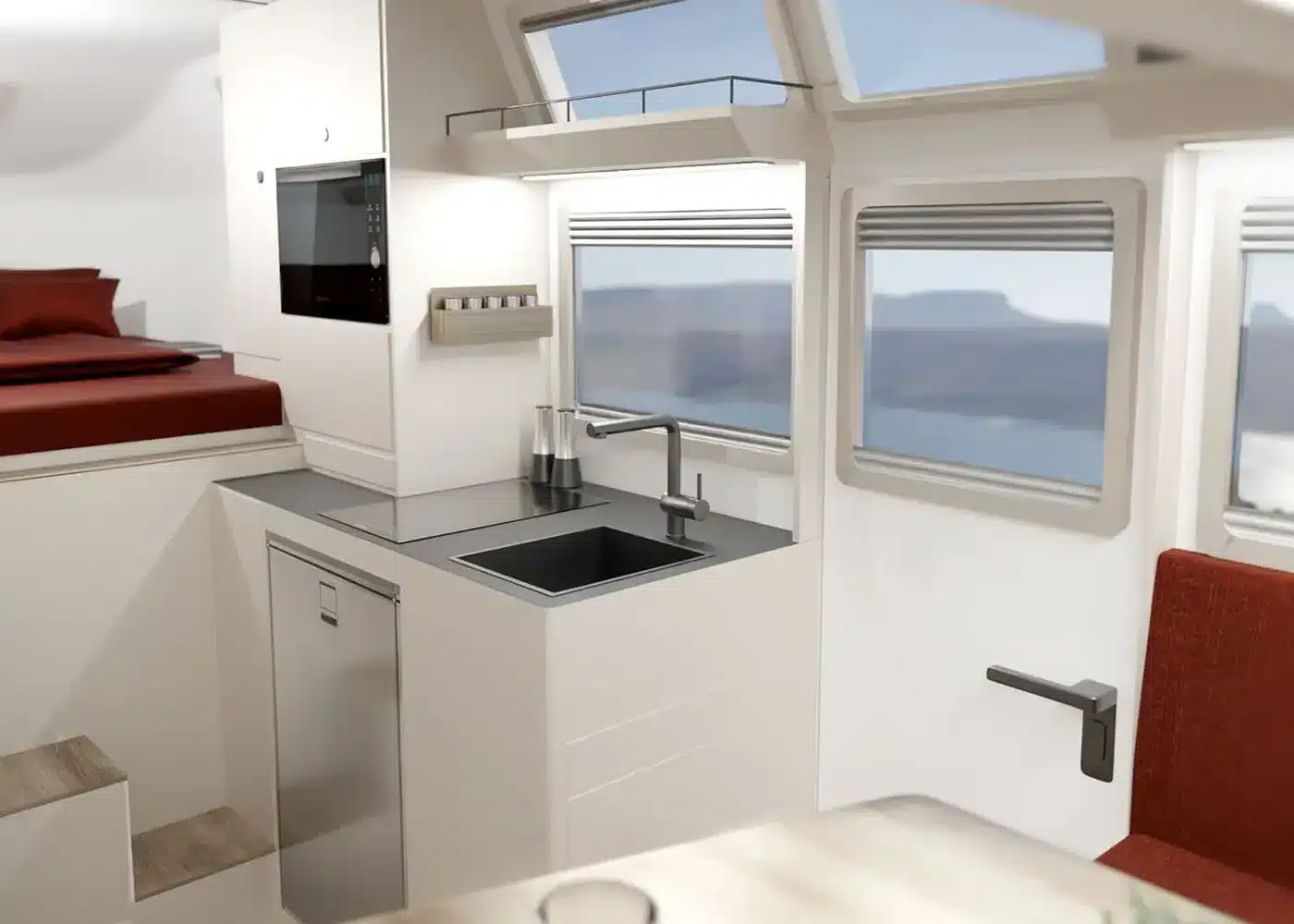 Innenansicht der Findus Wohnkabine mit Küchenzeile, Bett und modernen Fenstern