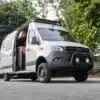 Project Nautilus Campervan auf Basis Mercedes Sprinter 419 mit geöffnetem Seiteneinstieg und sichtbarem Innenausbau