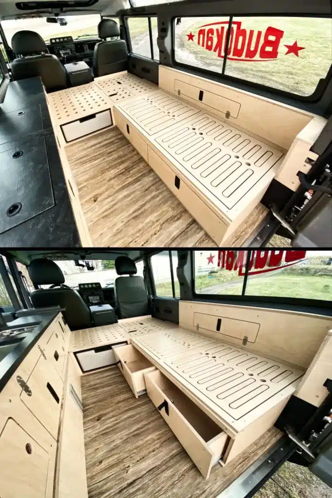 Detailreicher Innenausbau eines Land Rover Defender 110 Station Wagon als Camper mit Längsbank, Küchenzeile und viel Stauraum