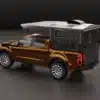 Aquila S Slide-In Reisekabine montiert auf braunem Ford Ranger Pick-up in Studioansicht