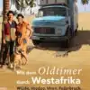 Cover des Buchs 'Mit dem Oldtimer durch Westafrika' mit einem blauen Mercedes-Oldtimer-LKW, zwei Personen, Hund und Wüstenlandschaft mit Palmen.