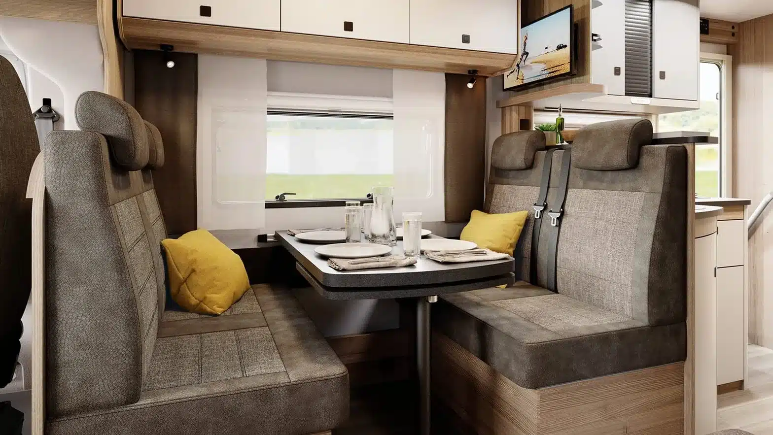 Sitzgruppe und Esstisch im Familienwohnmobil Hobby ONTOUR A 720 GFM mit einladender Polsterung und modernem Design.