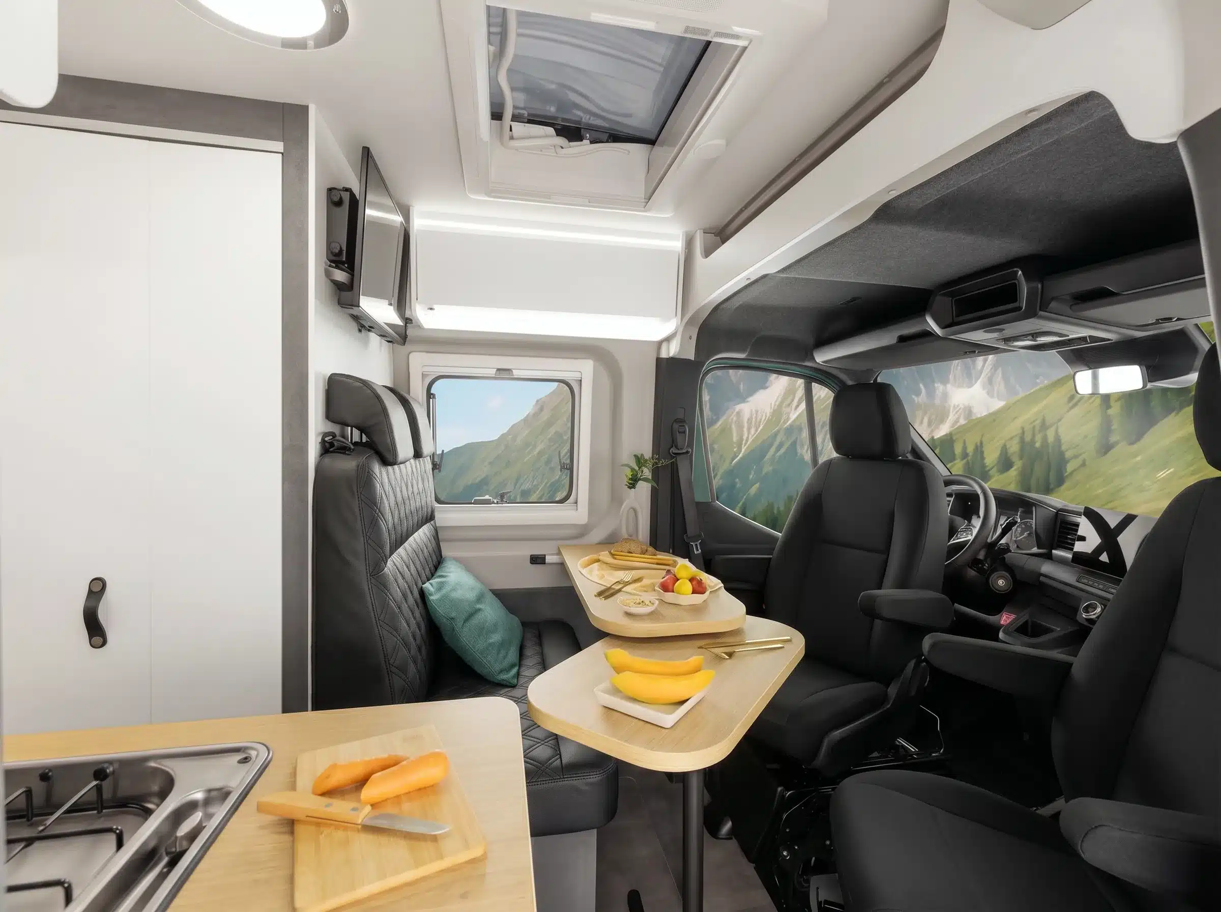 Innenraum des Ahorn Camp CV 630 ECLIPSE mit schwarzer Sitzgruppe, Dinette, Küche und Fahrerhaus