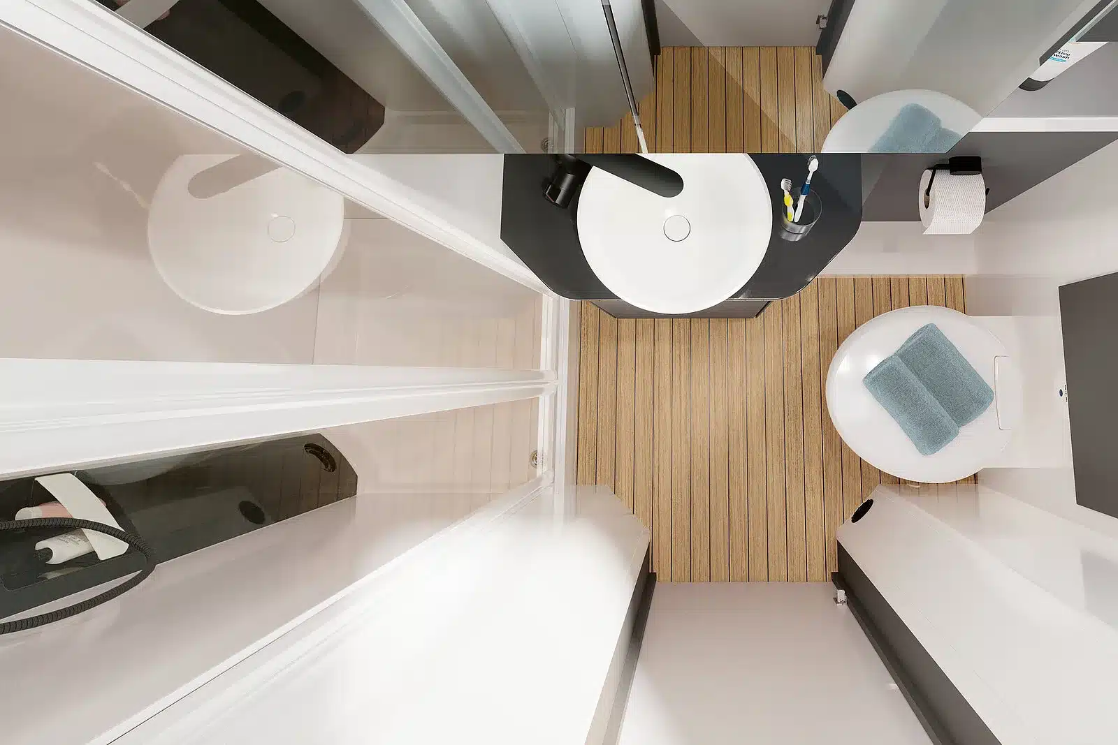 Waschraum im Hobby PRESTIGE T 740 WE Reisemobil mit Waschbecken, Toilette und Holzoptik-Boden.
