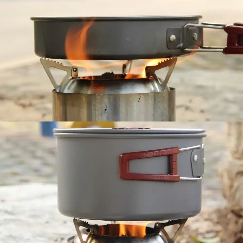 Edelstahl-Outdoor-Kocher mit Topf und brennendem Feuer beim Camping